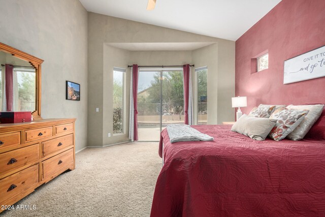 bedroom featuring access to exterior, lofted ceiling, and light carpet