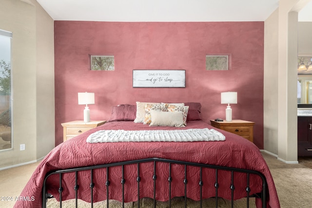 bedroom with carpet and ensuite bathroom