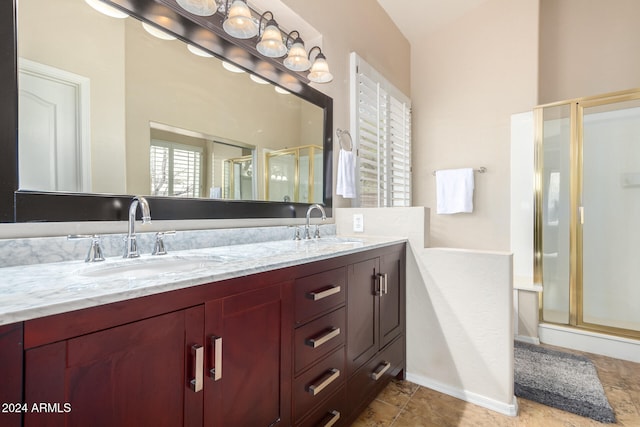 bathroom featuring vanity and an enclosed shower