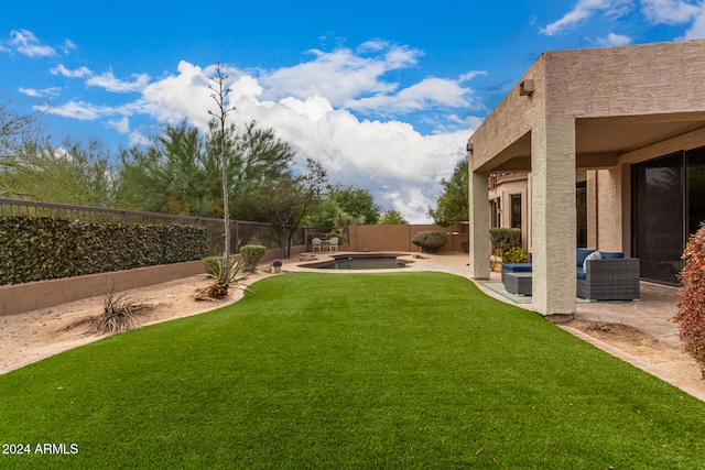 view of yard featuring a patio and a fenced in pool