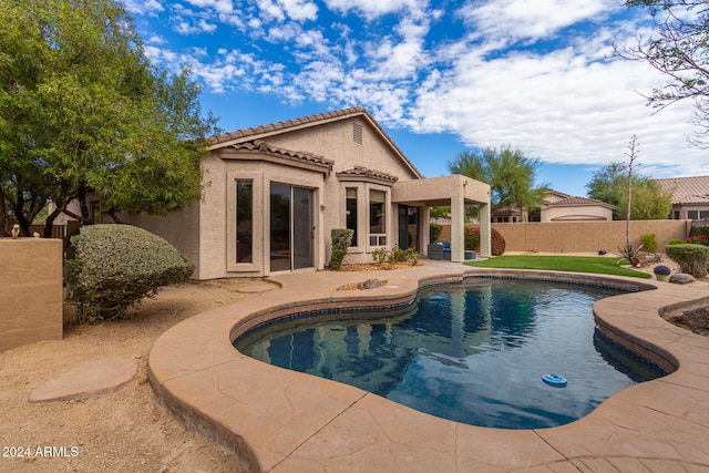 view of swimming pool featuring a patio area