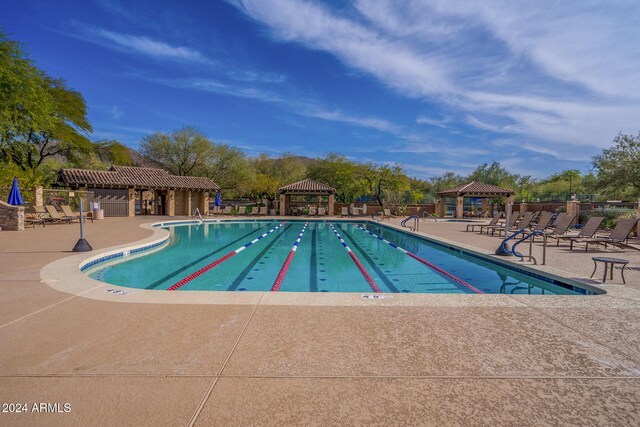 view of pool featuring a patio and a gazebo