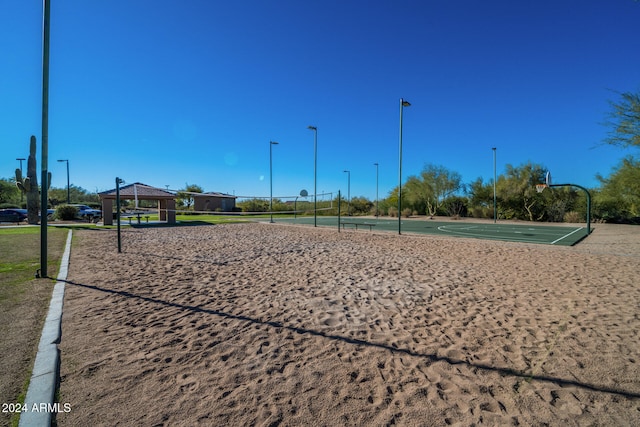 surrounding community featuring basketball hoop and volleyball court