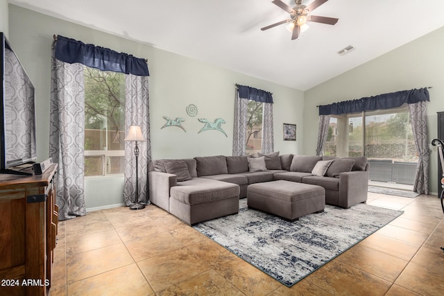 living room featuring ceiling fan and lofted ceiling