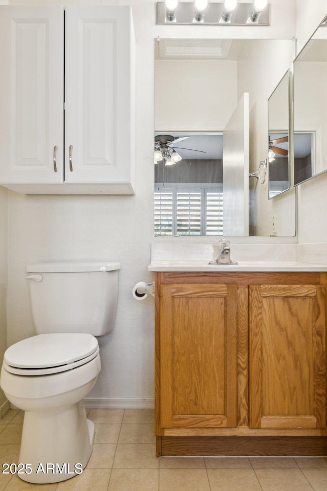 bathroom featuring ceiling fan, toilet, tile patterned flooring, and vanity