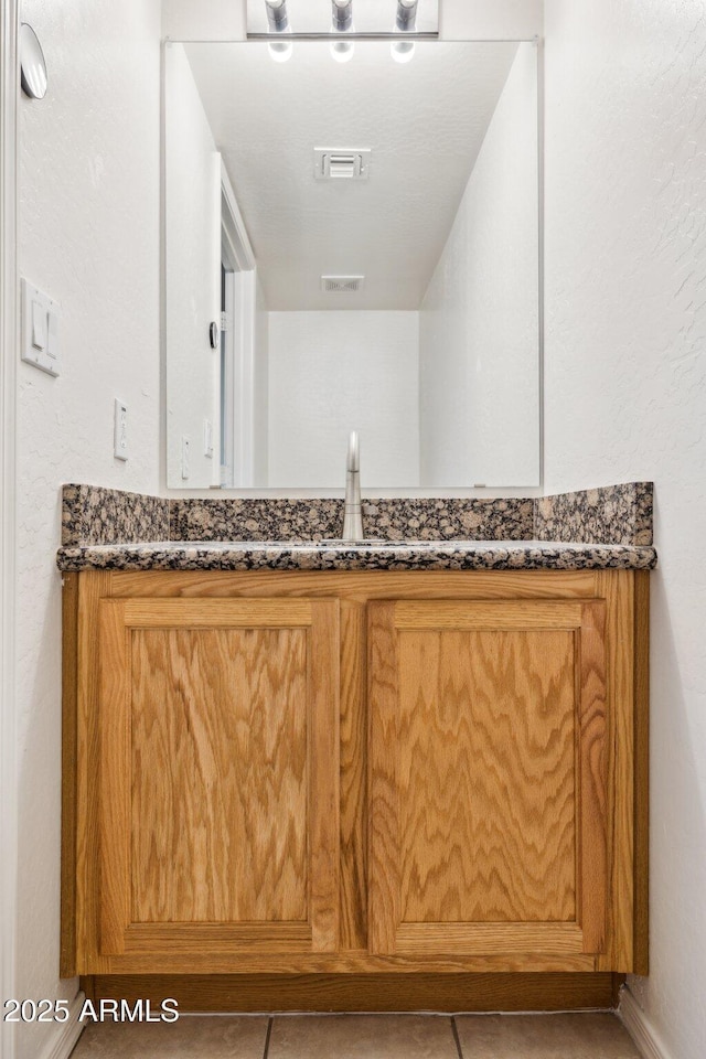 bathroom featuring visible vents and vanity