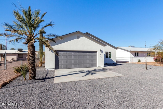 ranch-style house featuring a garage