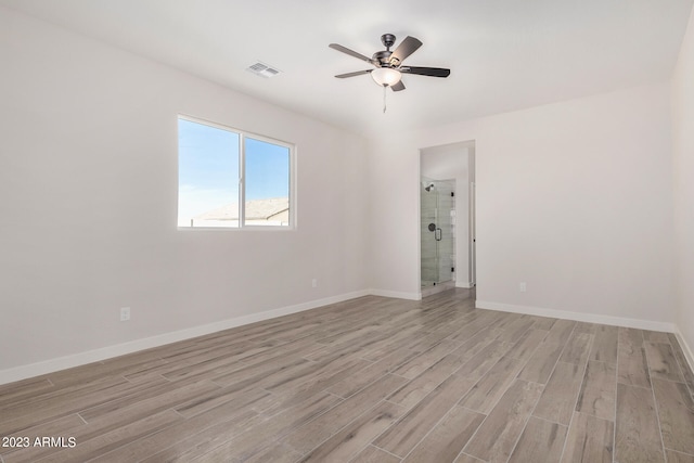 spare room with light hardwood / wood-style flooring and ceiling fan