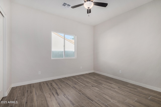 spare room featuring ceiling fan and hardwood / wood-style floors