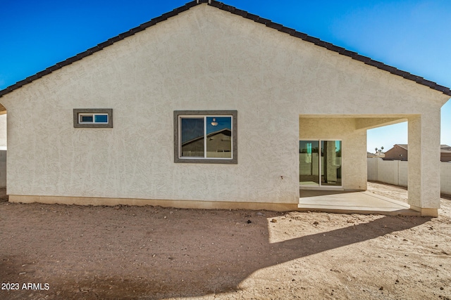 rear view of property featuring a patio area