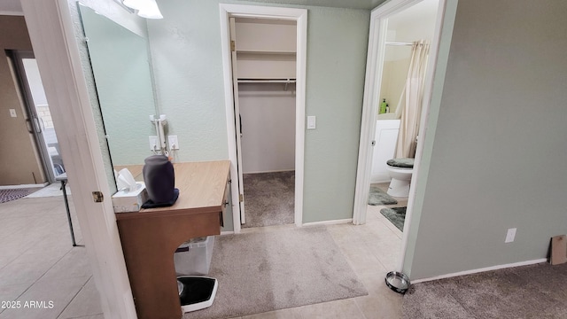 650 N 65th Way, Mesa, AZ 85205 - full bath featuring toilet, tile patterned flooring, a spacious closet, and baseboards