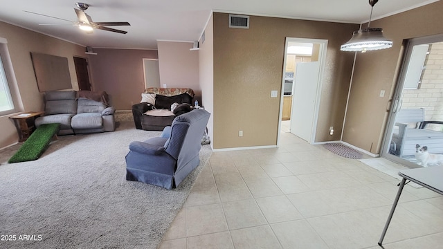 650 N 65th Way, Mesa, AZ 85205 - living room with ornamental molding, ceiling fan, light tile patterned floors, and baseboards