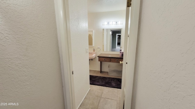 650 N 65th Way, Mesa, AZ 85205 - hallway with a textured wall, tile patterned flooring, and baseboards
