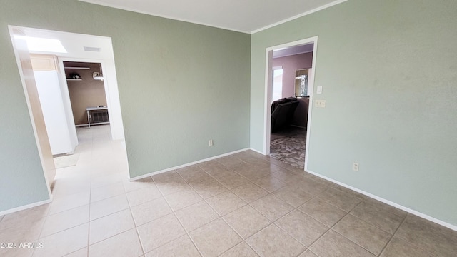650 N 65th Way, Mesa, AZ 85205 - unfurnished room with light tile patterned flooring, crown molding, and baseboards