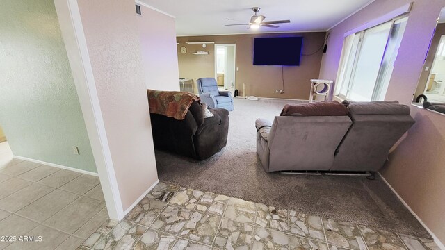 650 N 65th Way, Mesa, AZ 85205 - carpeted living room featuring a ceiling fan and baseboards