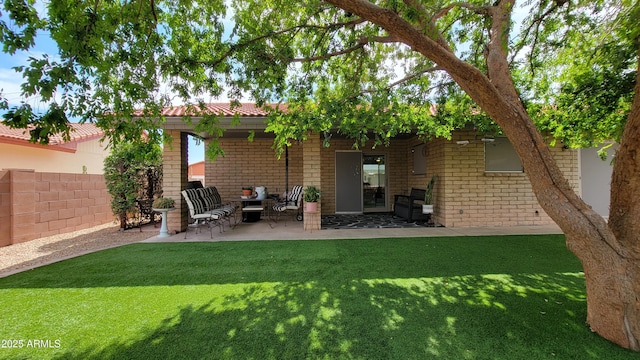 650 N 65th Way, Mesa, AZ 85205 - back of house featuring brick siding and a patio area