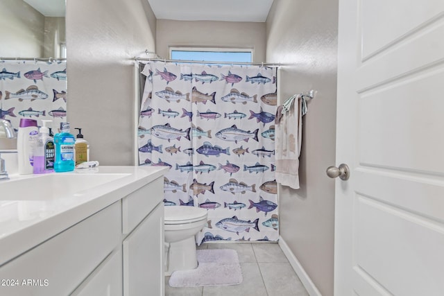 bathroom with toilet, vanity, a shower with curtain, tile patterned flooring, and baseboards
