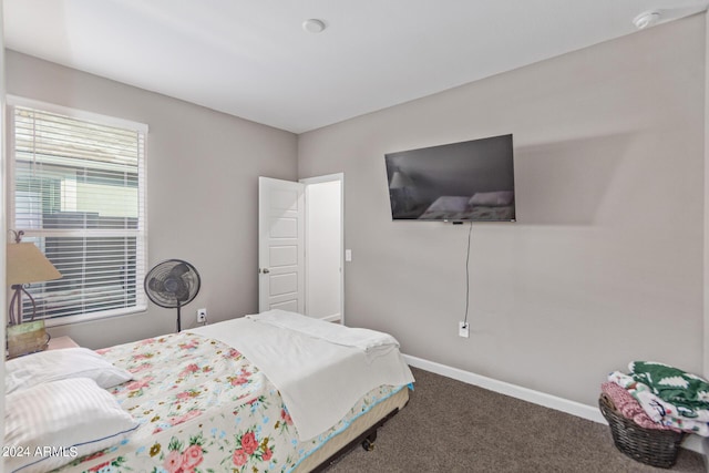 bedroom featuring baseboards and carpet flooring