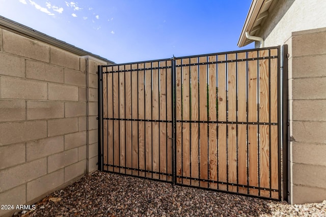 view of gate featuring fence