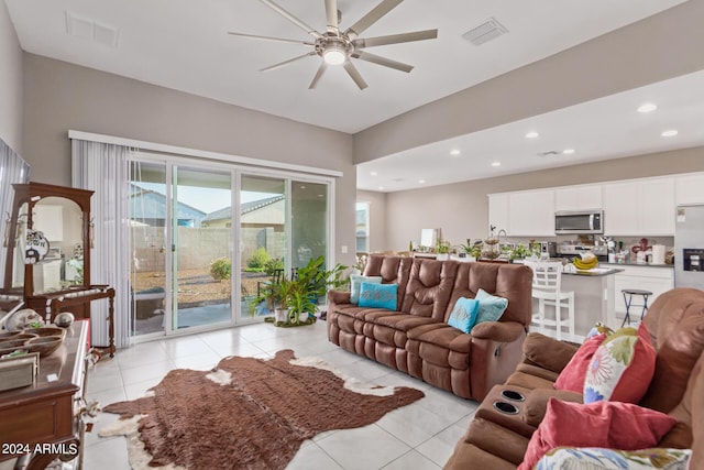 living room with a ceiling fan, recessed lighting, light tile patterned flooring, and visible vents