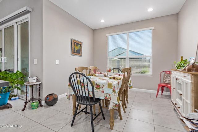 dining space featuring light tile patterned flooring, baseboards, and recessed lighting