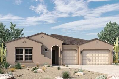 mediterranean / spanish home featuring an attached garage, concrete driveway, and stucco siding