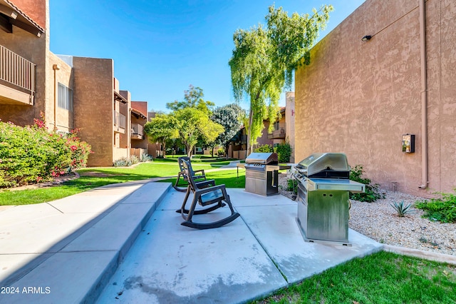 view of patio / terrace with grilling area and a balcony