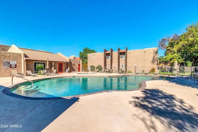 view of swimming pool with a patio area