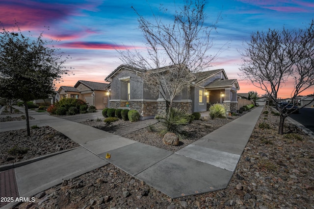 view of front of house with stone siding and stucco siding