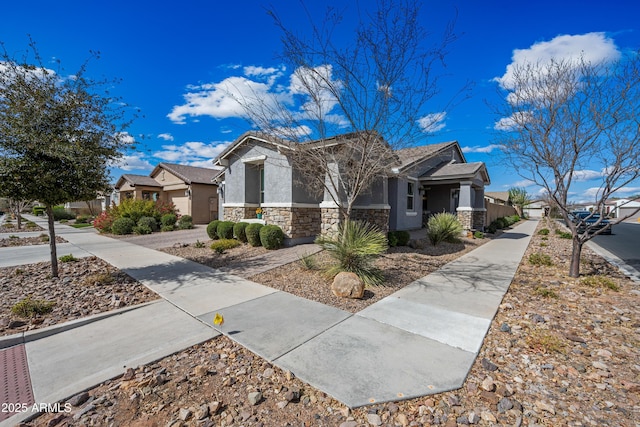 view of property exterior with stone siding, a residential view, and stucco siding