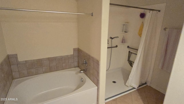 bathroom featuring tile patterned flooring and shower with separate bathtub