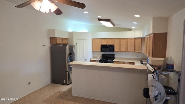 kitchen featuring black appliances, ceiling fan, kitchen peninsula, and vaulted ceiling