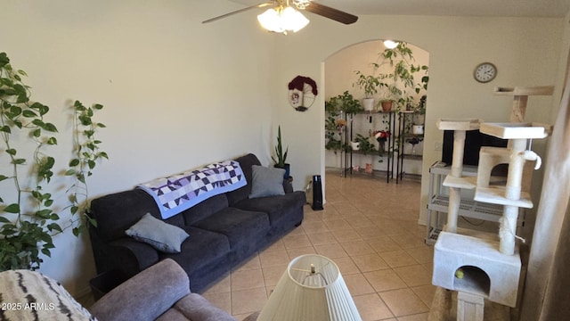 living room with light tile patterned floors and ceiling fan