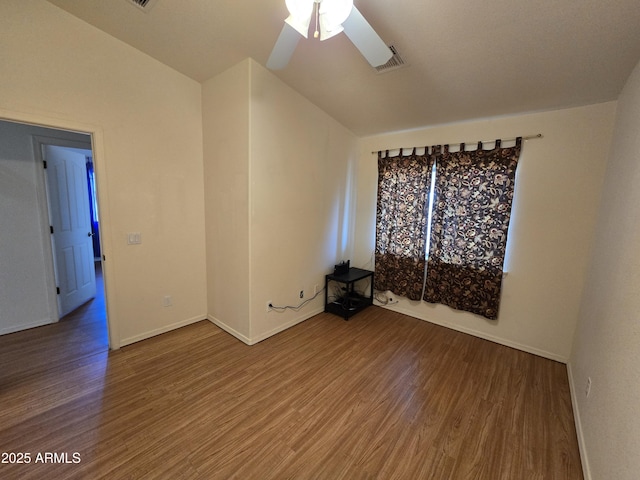 spare room featuring hardwood / wood-style flooring and ceiling fan