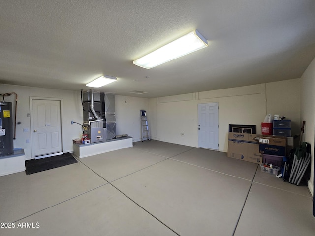 garage with heating unit and electric water heater