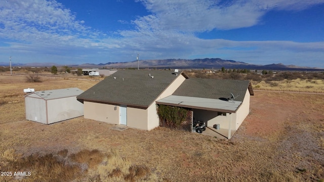 birds eye view of property featuring a mountain view