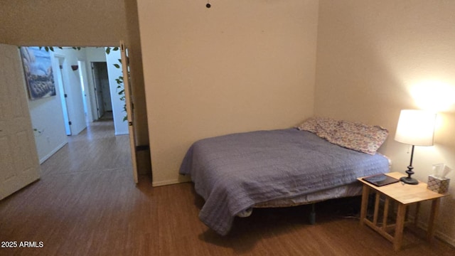 bedroom featuring dark hardwood / wood-style flooring