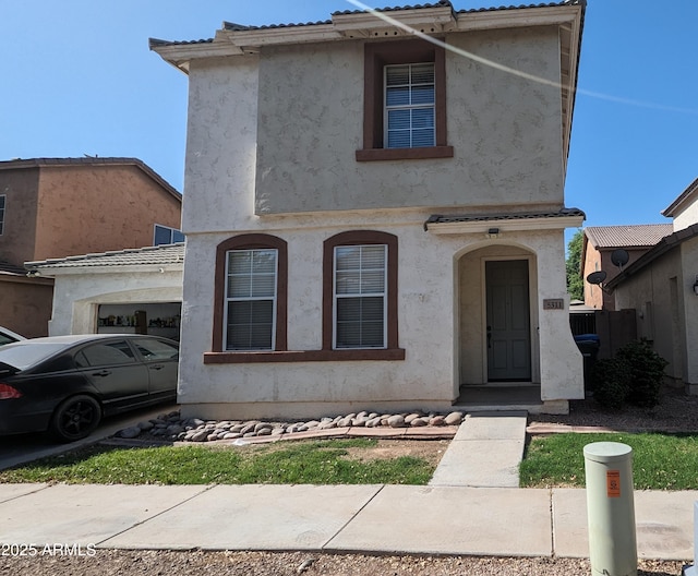 5311 W Fulton St, Phoenix, AZ 85043 - view of front of home with a garage and stucco siding