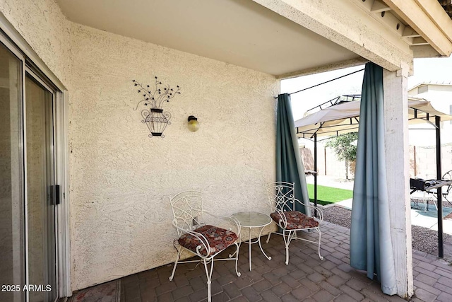 view of patio / terrace with a lanai