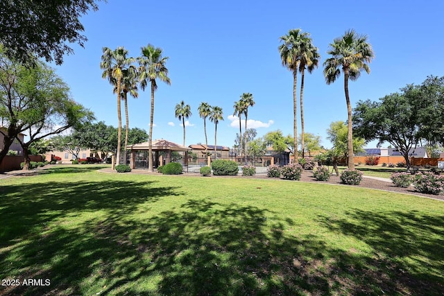 view of property's community with a lawn and a gazebo