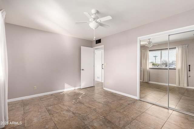 unfurnished bedroom featuring a closet and ceiling fan