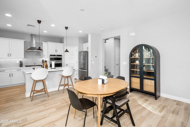 dining room with light wood-type flooring