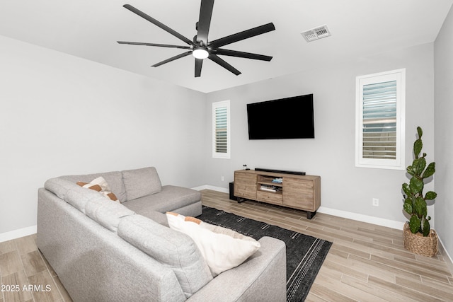 living room featuring ceiling fan