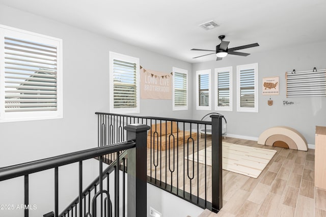 hall with light hardwood / wood-style flooring