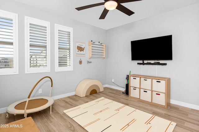 interior space featuring light hardwood / wood-style flooring and ceiling fan