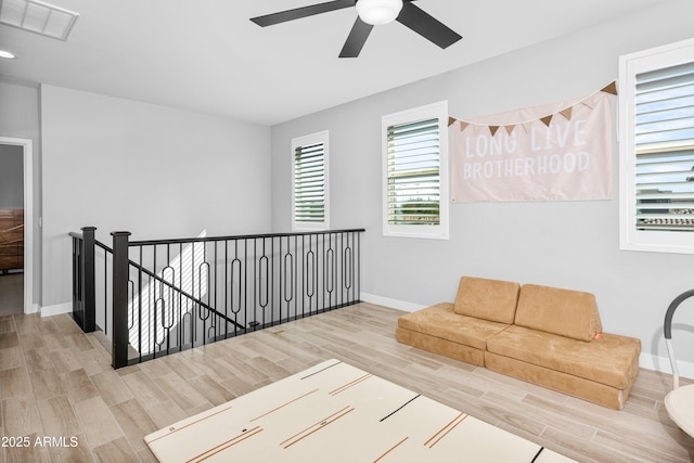 unfurnished room featuring ceiling fan and light wood-type flooring