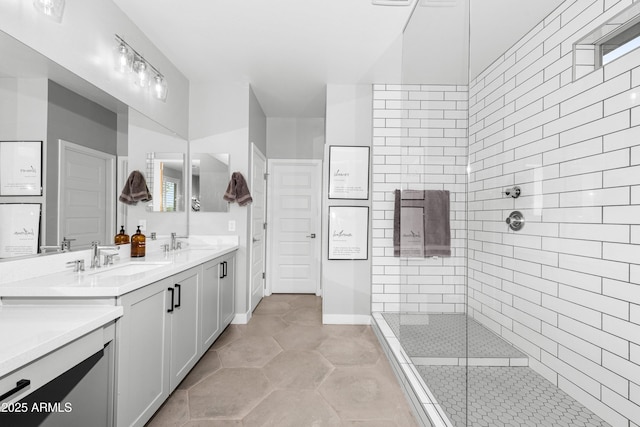 bathroom with vanity and tiled shower