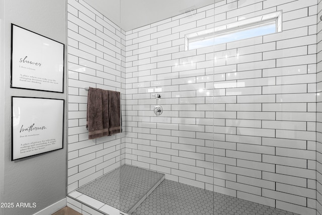 bathroom with tiled shower