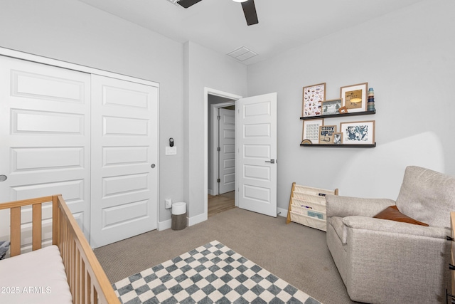 carpeted bedroom featuring a closet and ceiling fan