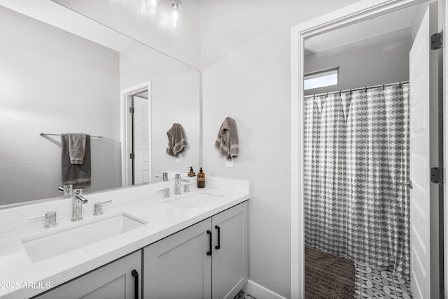 bathroom featuring vanity and a shower with shower curtain